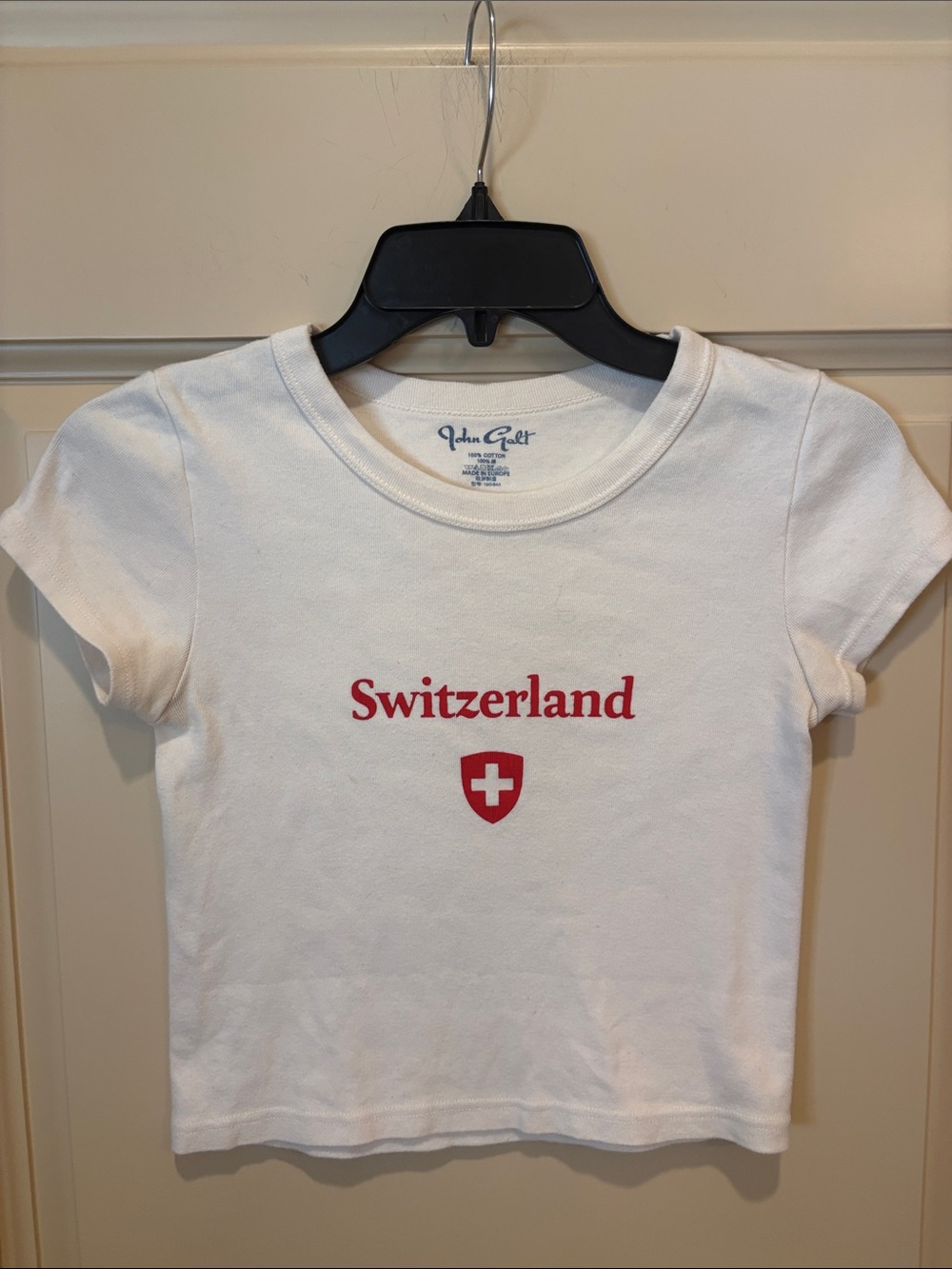 Brandy Melville “Switzerland” White Tee with Red Graphic